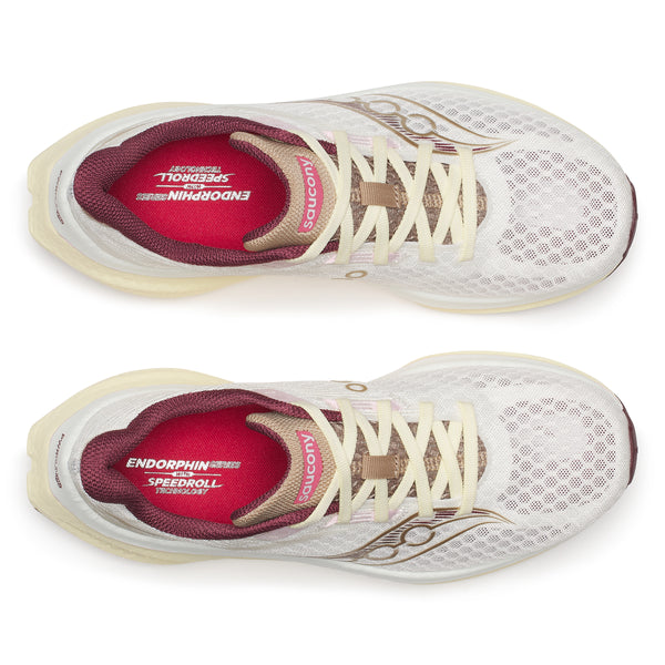 White running shoes with maroon soles on a white background