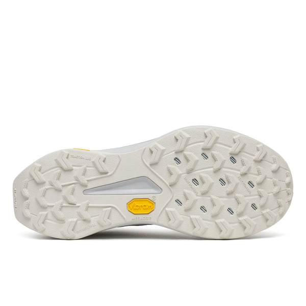 Close-up of a shoe sole with tread pattern and brand logo on a white background
