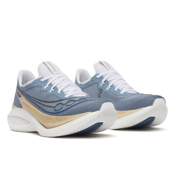 Pair of blue and beige running shoes on a white background