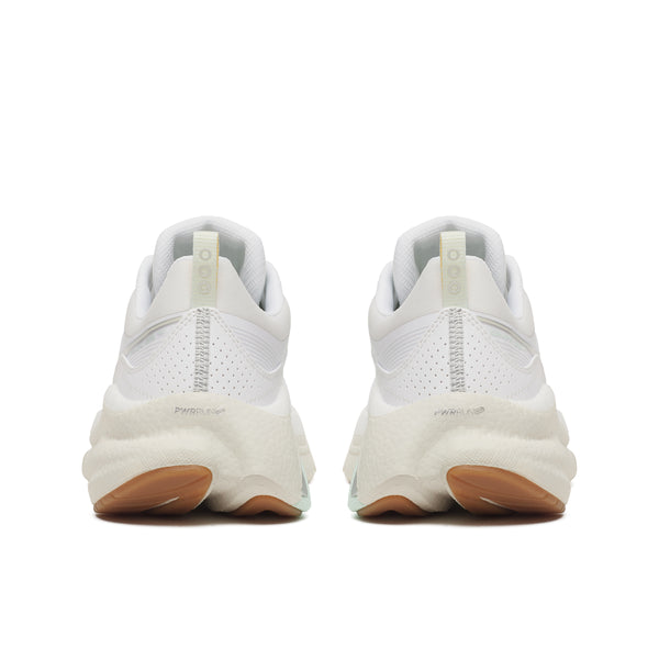 White sneakers with brown soles on a white background
