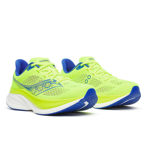 Pair of neon green Saucony running shoes with blue accents on a white background.