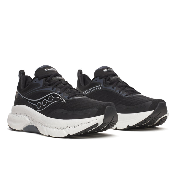 Pair of black and white Saucony running shoes on a white background
