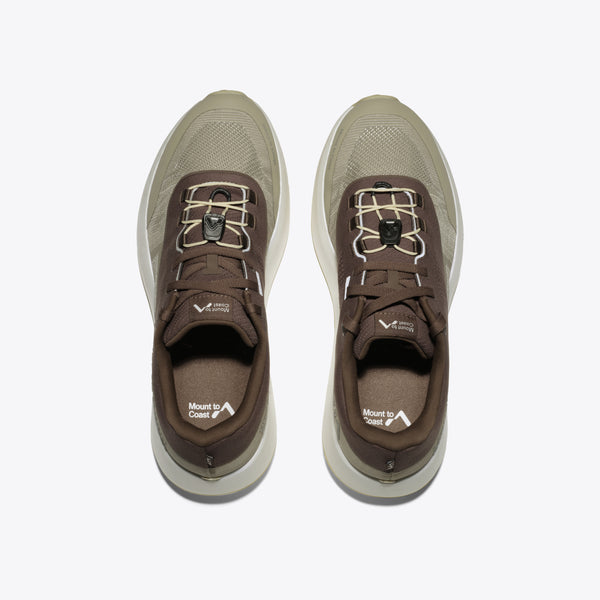 Mount to Coast featuring a brown and olive green upper, a thick cream-colored platform midsole, and a light tan outsole.