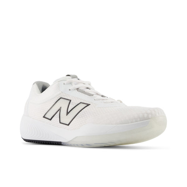 A NB tennis shoe sitting at a diagaonl angle.