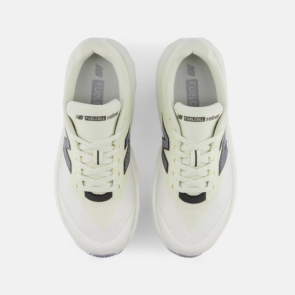 A pair of New Balance FuelReboot running shoes in a light cream/off-white colorway with dark gray accents, shown from a top-down view on a light gray background.