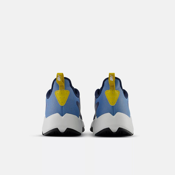 A pair of Nike sneakers shown from the back, featuring a light blue mesh upper, dark navy collar lining, a bright yellow pull tab, and a chunky white and black sole.
