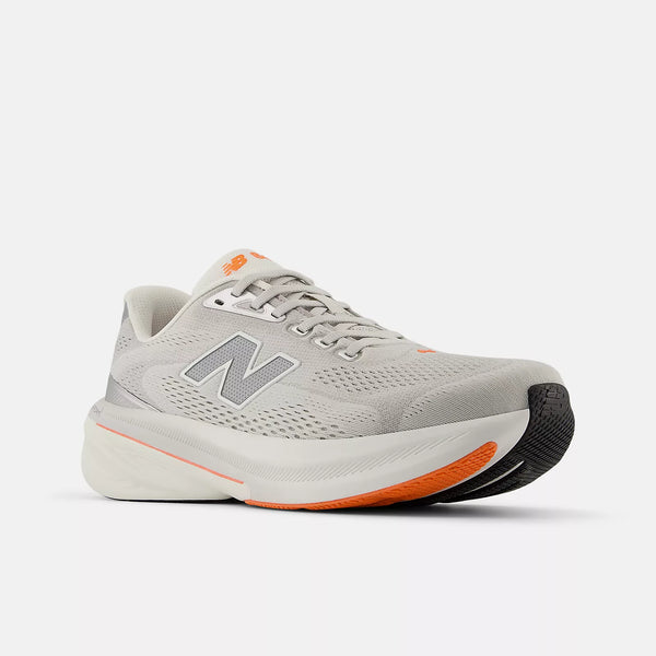 The men's new balance 860 has a grey upper and orange pops on the outsole.