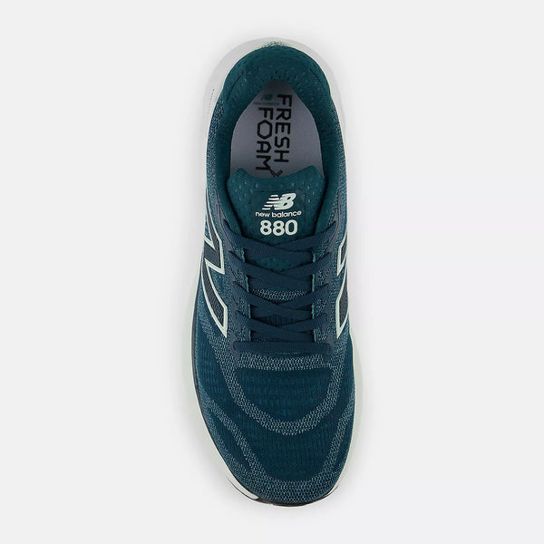 Navy blue and dark green New Balance 880 sneaker on a white background