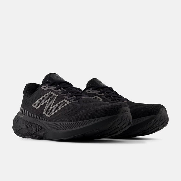 Black running shoes with New Balance logo on a light gray background