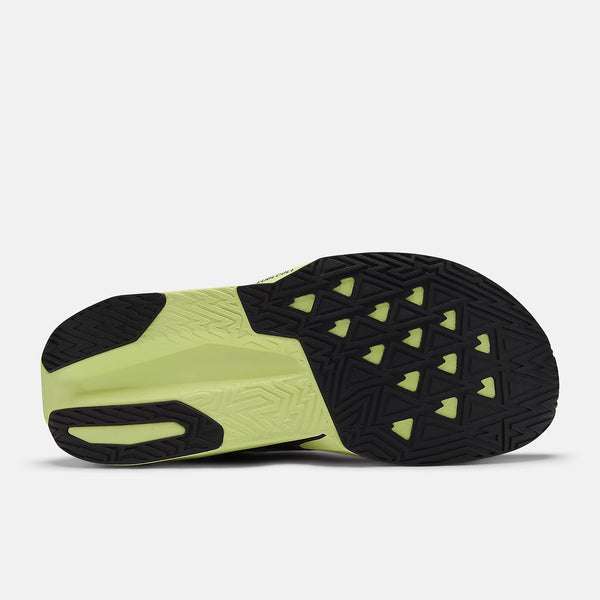 The outsole of the Fuel Cell Rebel V4 as mostly all black rubber for durability.