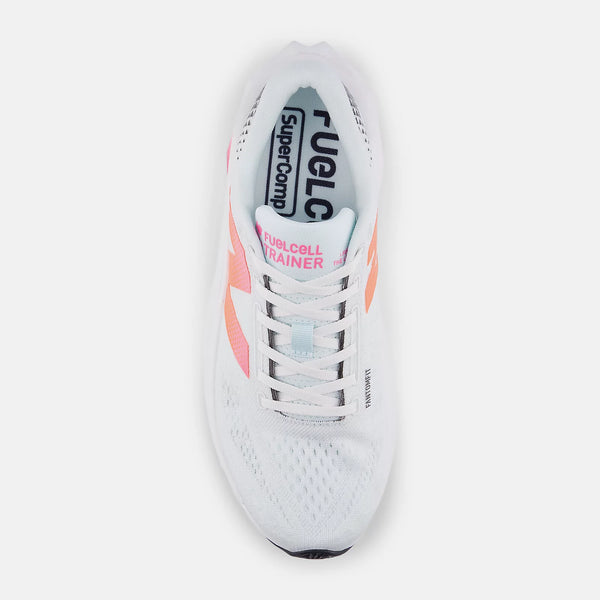 White running shoe with pink accents on a white background
