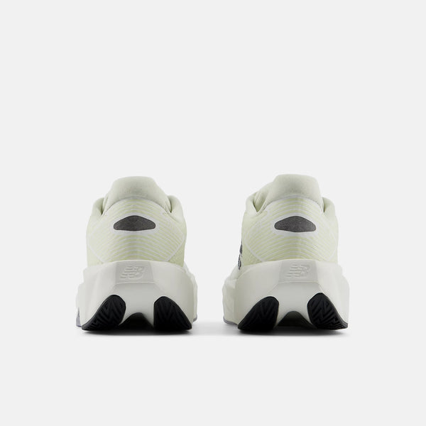 A pair of New Balance running shoes shown from the rear, featuring a light off-white mesh upper, a thick white midsole with a black sculpted outsole, and a dark gray heel insert.