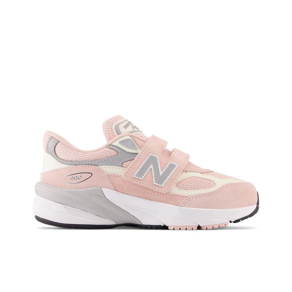 From the lateral view, the fun pinkish colors of this Kid's NB 990 are dispalyed