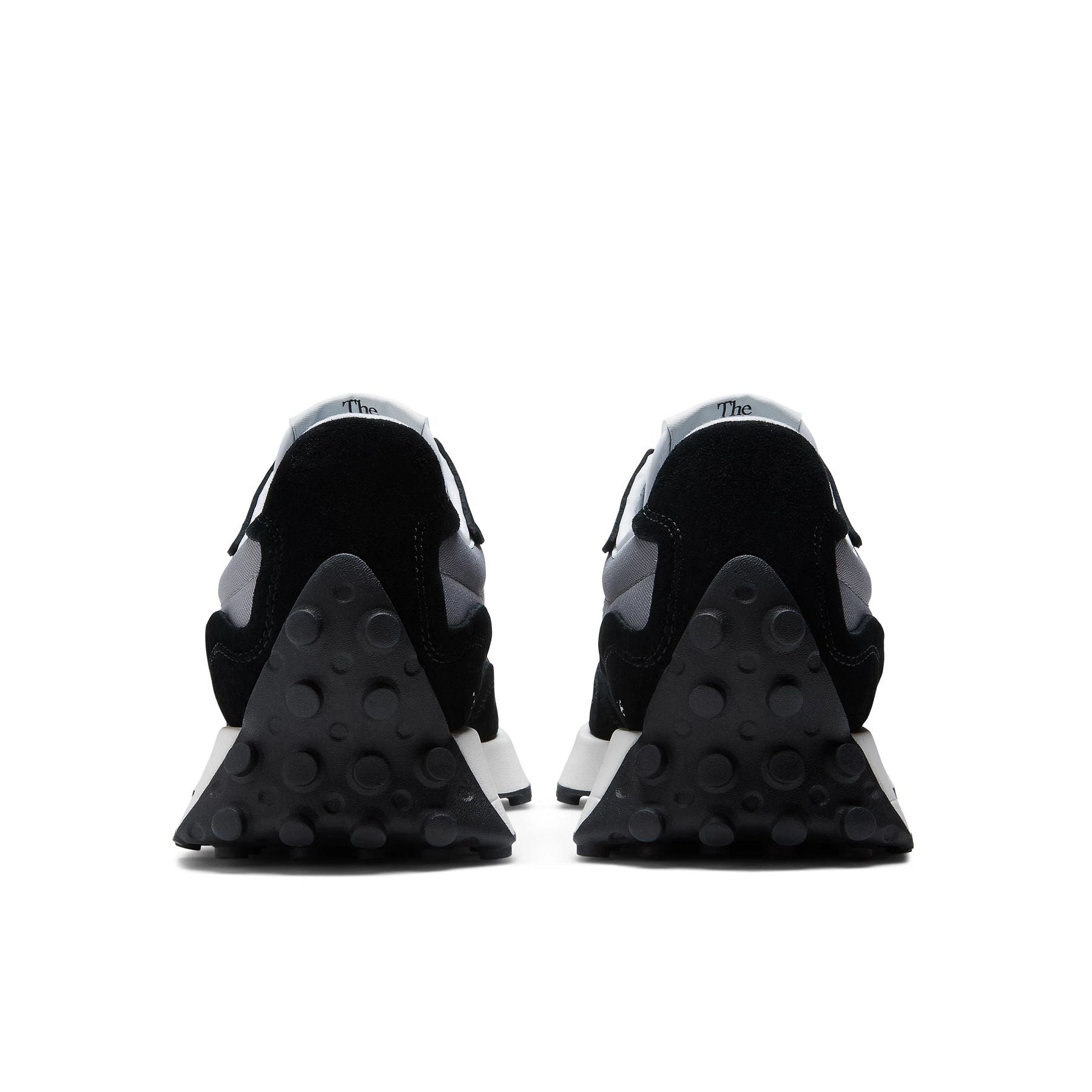 Back view of the Men's New Balance 327 lifestyle shoe in Black/Grey