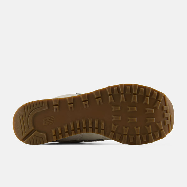 Close-up of a shoe sole with brown tread pattern on a white background
