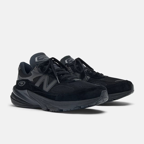 Black sneakers with gray accents on a white background