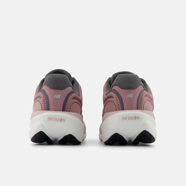 Pair of pink running shoes with 'Infinion' branding on a white background