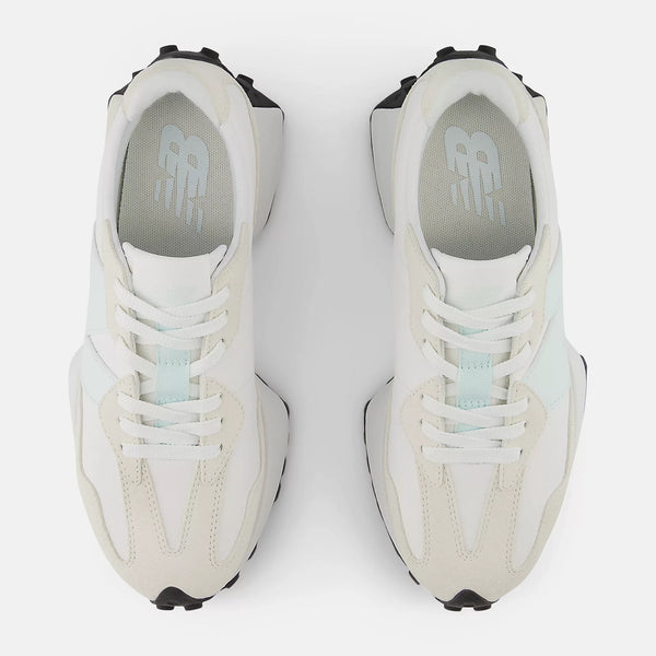 White sneakers with black accents on a white background