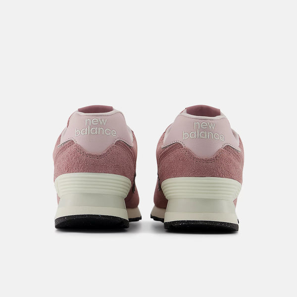 The heel of thes shoes has the brand name New Balance near the top.