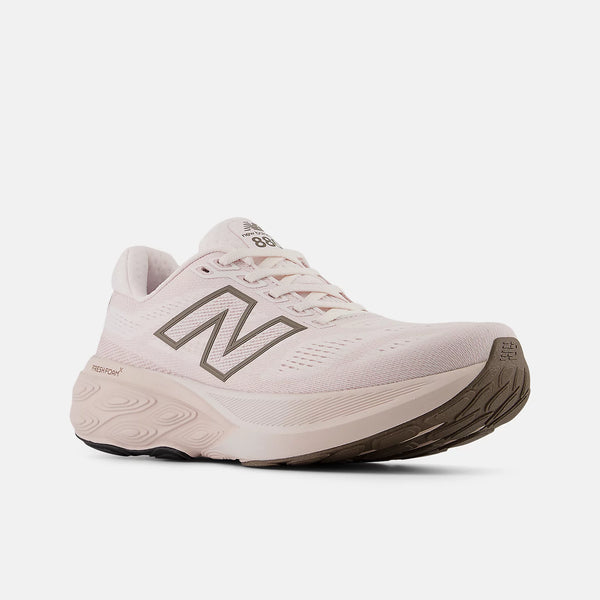 Pink running shoe with 'N' logo on a white background