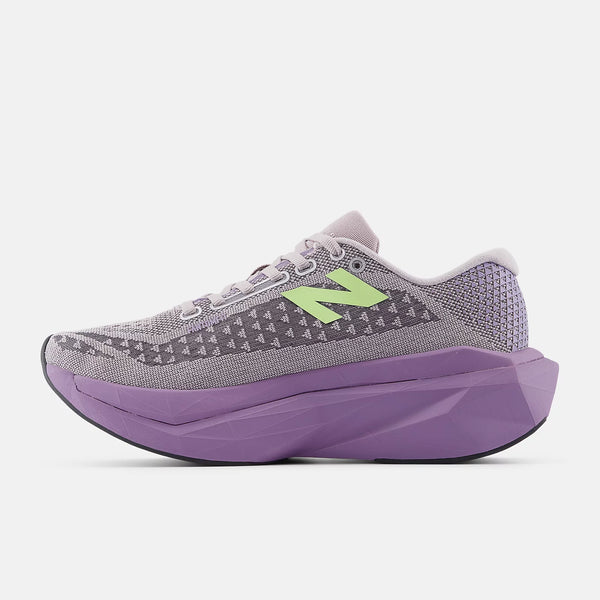Gray and purple running shoe with a green logo on a white background