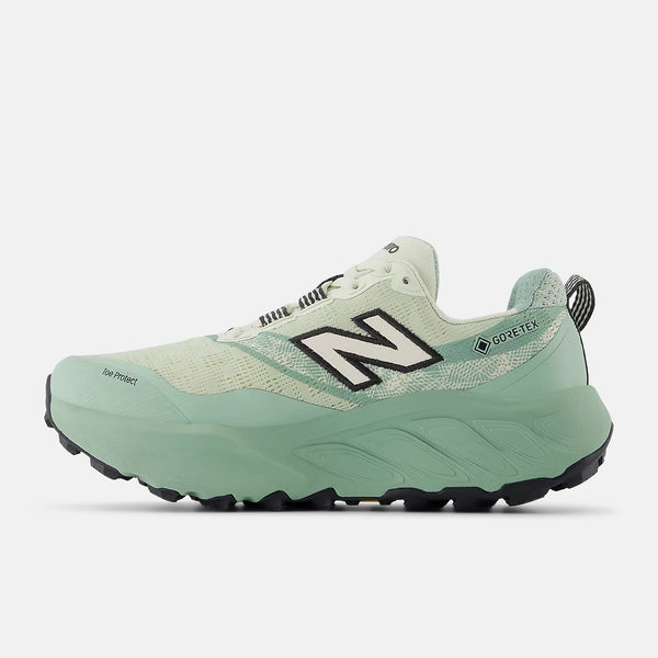 The medial side of a new balance trail shoe that says Gore-tex on the side.