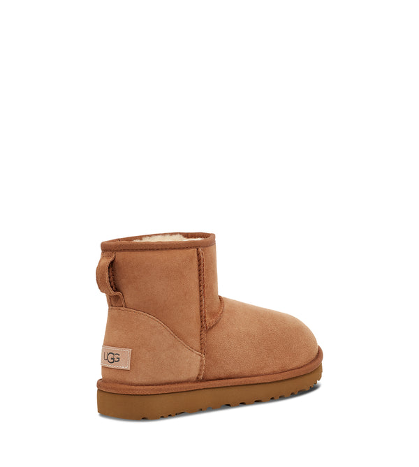 UGG is printed horizontally on a tag stitched to the heel of this boot.