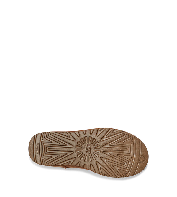 The outsole of this boot has UGG carved into the middle.