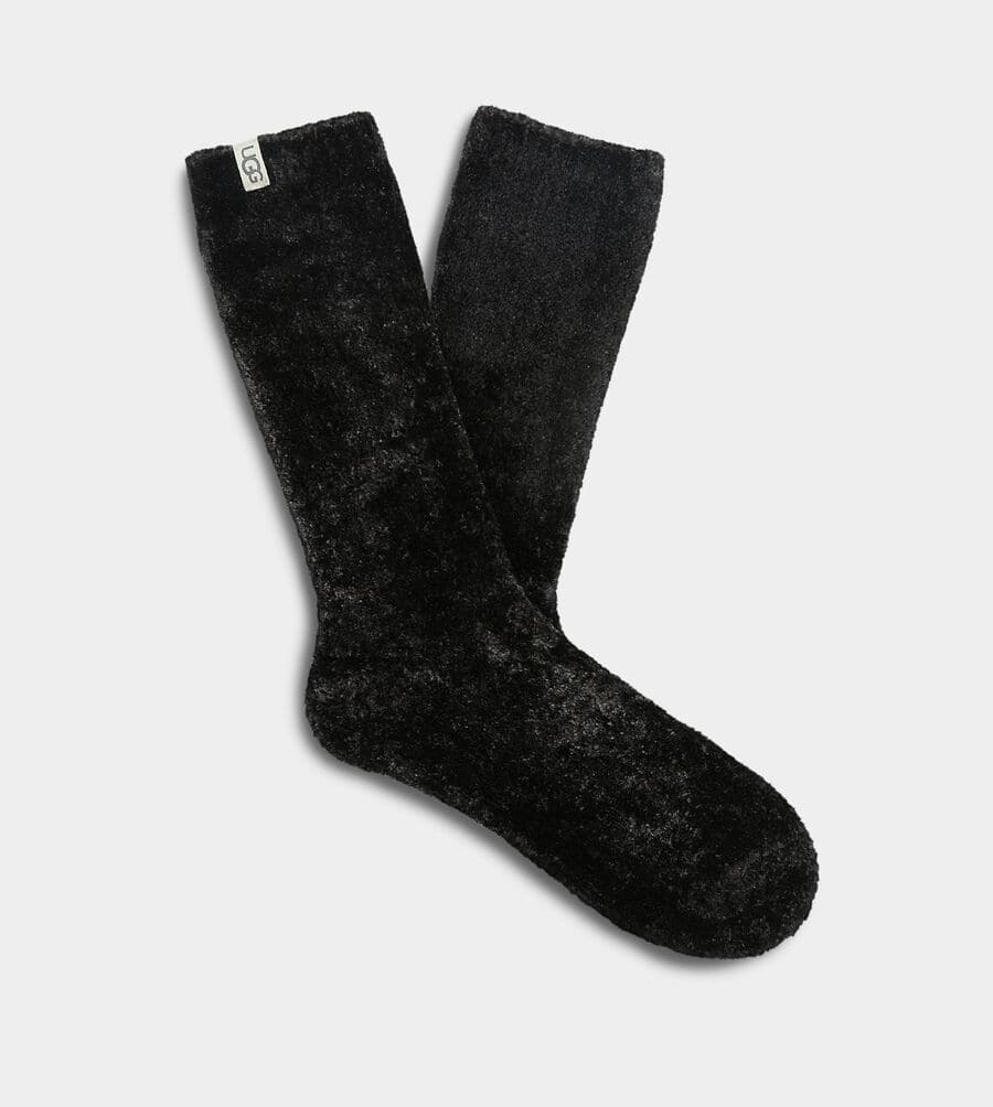 These ultra cozy Ugg crew socks have a stretchy, soft feel that your feet will love!  Great for lounging around at home, the versatile cut works equally well with boots.  Made from 100% Polyester.