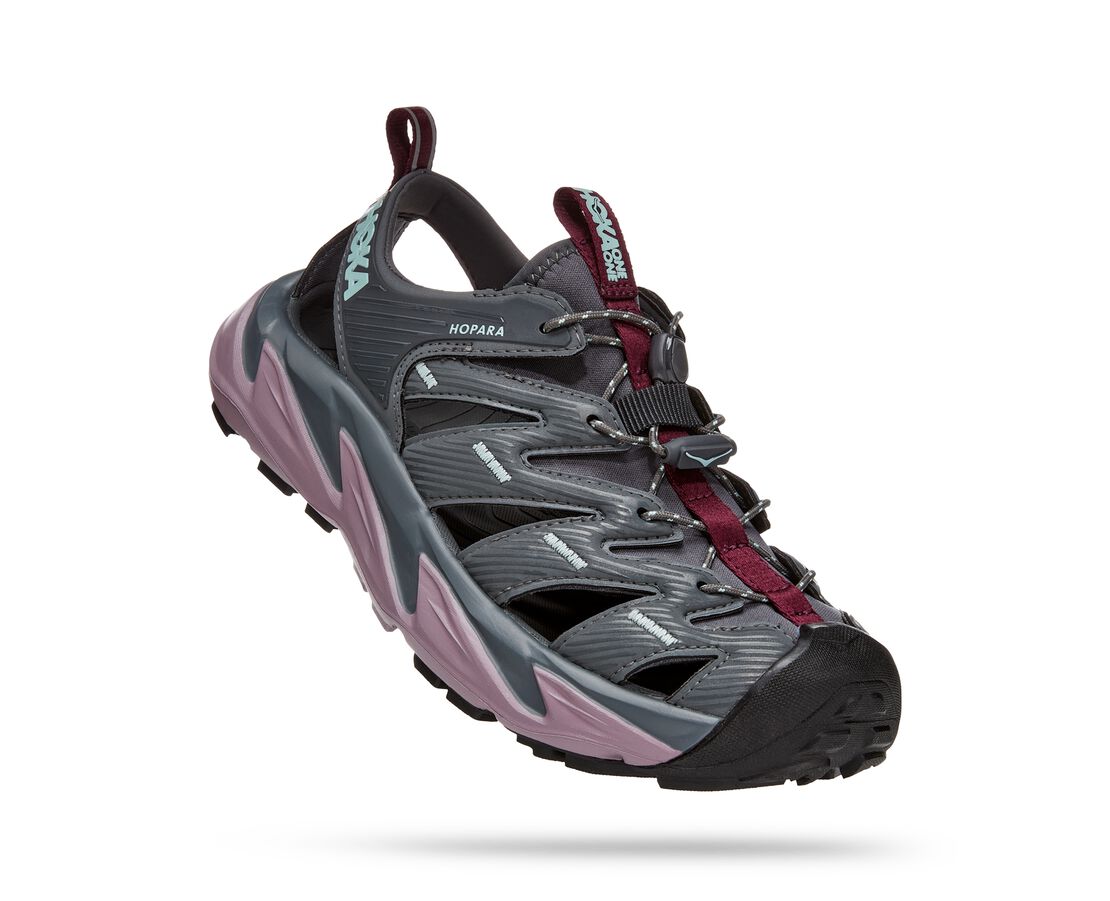 A true outdoor explorer, the Women's Hopara from Hoka easily navigates through any terrain — rivers, lakes or trails all look different in these shoes. Designed through the HOKA lens, this shoe will blow other mountain sandals out of the water.  The Hopara has a synthetic upper with strategic cutouts for drainage while still providing a secure lockdown. It includes a neoprene collar for flexibility and comfort plus a quick-lace system.