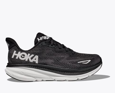 Lateral view of the Men's HOKA Clifton 9 in the men's wide 2E width, color Black/White