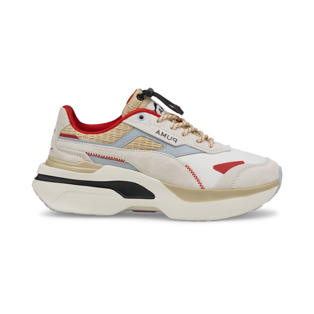 Grab the attention in your next match wearing the Women's PUMA Kosmo Rider Retro Grade sneakers. Centered around mixing and matching to enhance creativity, the retrograde iteration blends neutral tones with perfect pops of color for a sophisticated spin on '70s style. Featuring tons of texture, a chunky outsole, and bold PUMA branding, these funky kicks look fierce.