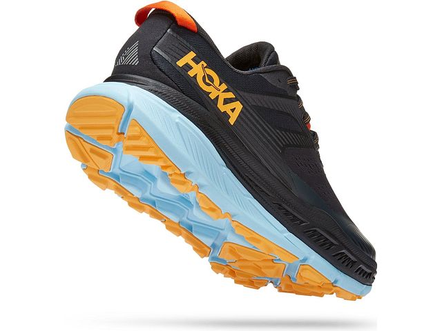 Back angled view of the Men's Stinson (All Terrain) shoe by HOKA in the color Blue Graphite / Summer Song