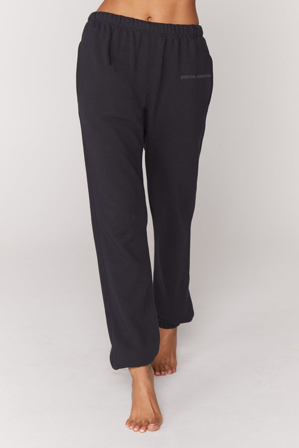 Women's SG Laguna Sweatpant in BlackYou were born to lounge. Full length means full comfort in our super soft and easy to wear SG Laguna Sweatpant. Made with 100% cotton, a slouchy and relaxed oversized fit for maximum comfort, elastic waistline and ankles, and "Spiritual Gangster" front logo. Perfect to throw on after a sweat session or for casual days.