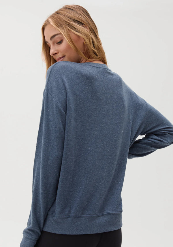 rear view of womens savasana pullover