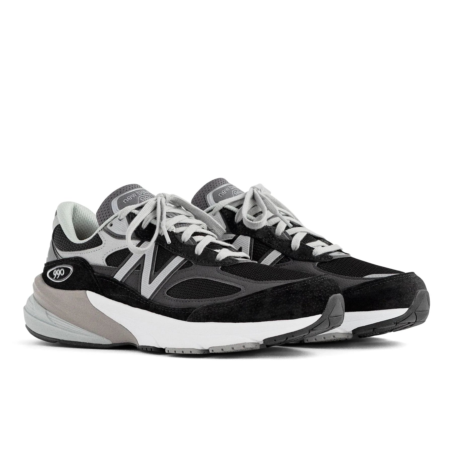 Front angle view of the Men's New Balance 990 V6 lifestyle shoe in the color Black/White