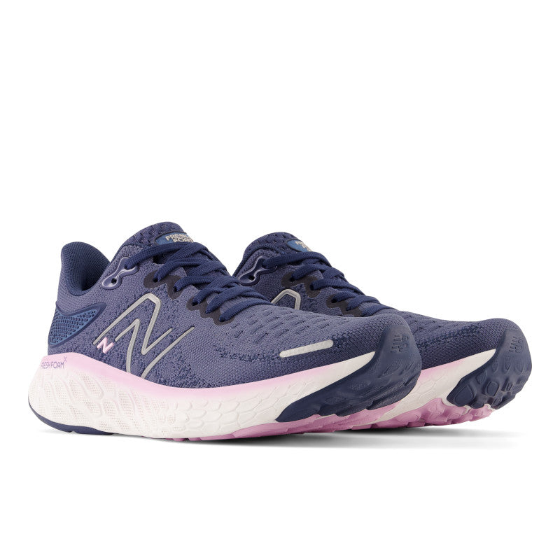 Front angle view of the Women's 1080 V12 by New Balance in the color Vintage / Indigo