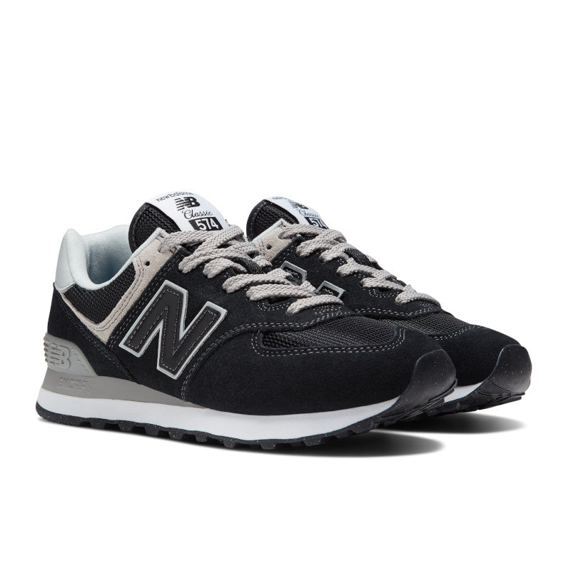 Front angle view of the Women's New Balance 574 lifestyle shoe in Black/White