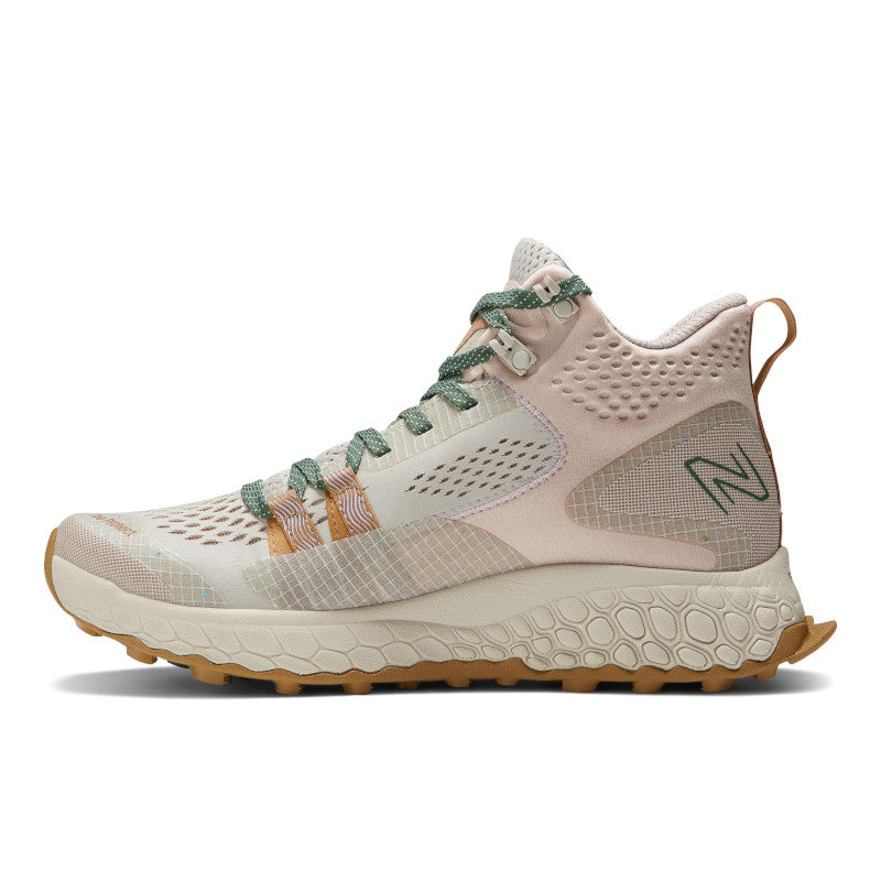 Medial view of the Women's Fresh Foam X Hierro Mid trail shoe by New Balance in the color Timberwolf / Dusted Clay
