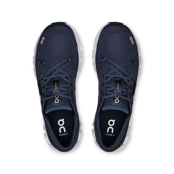 Navy and white athletic shoe on a white background