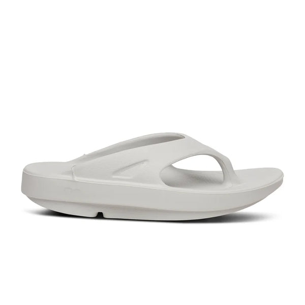 Very light grey thong sandal on a white background