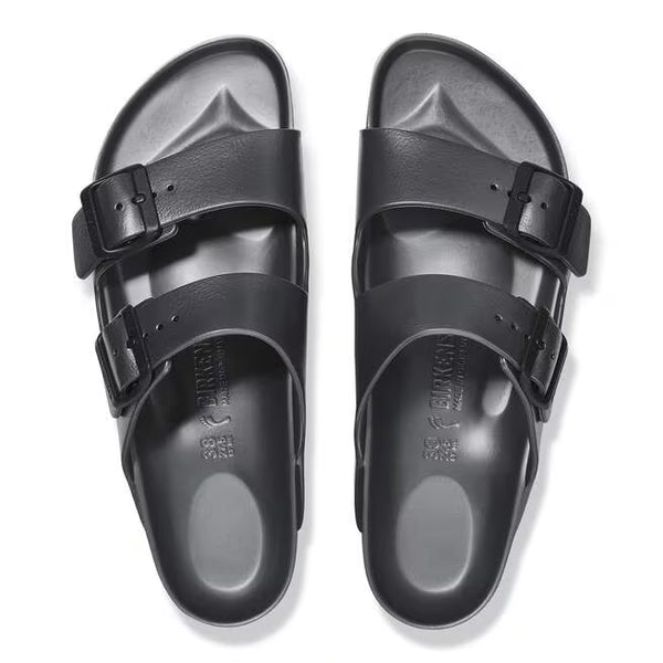 The buckles on the straps of this sandal are black and the sole of the shoe has Birkenstock printed vertically. 