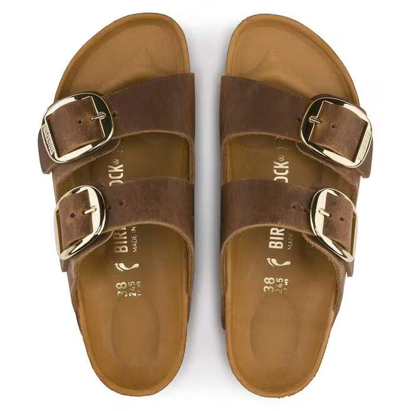 The upper of this shoe is two large straps with buckles on the lateral sides. 