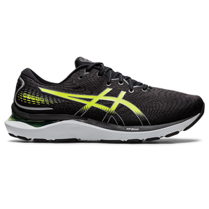 A pair of black Asics running shoes with green accents, featuring a mesh upper and a visible sole with various materials.