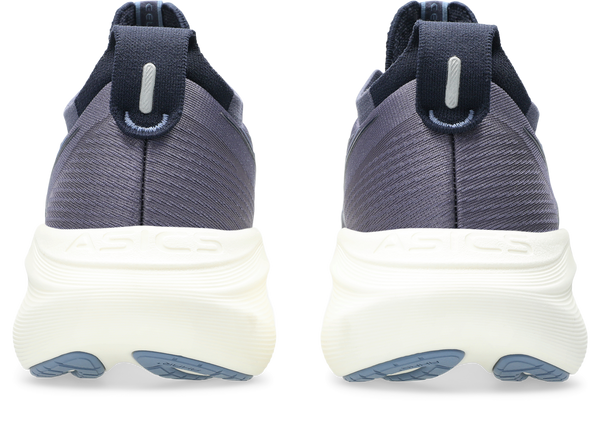 Pair of gray athletic shoes with white soles on a white background