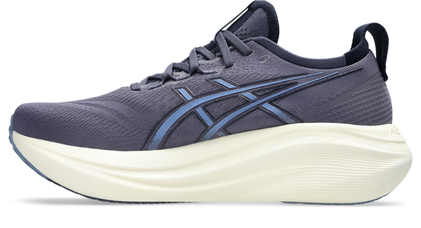 Medial side of a gray running shoe with white sole on a white background
