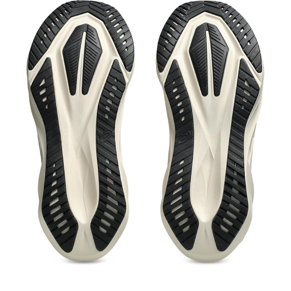 Close-up of a pair of black and white men's ASICS athletic shoes on a white background.