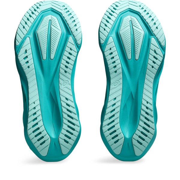 Teal shoe sole with textured design on a white background