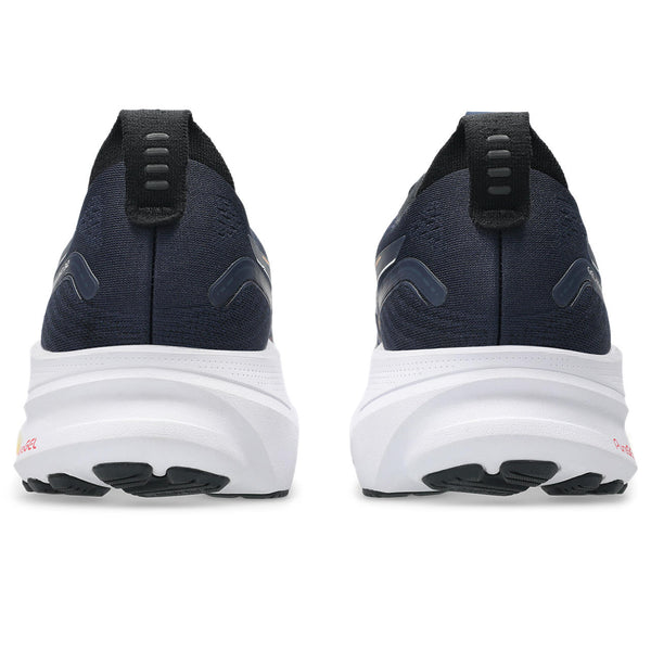 Navy ASICS running shoes with white soles on a white background.