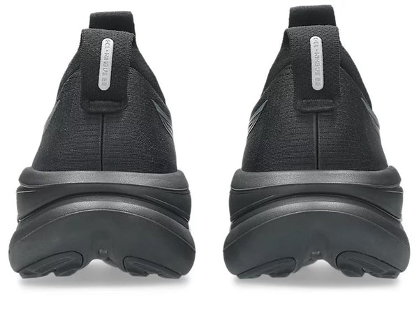 Black slip-on shoes with thick sole on a white background